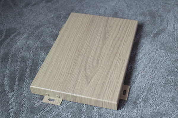 Compared with solid wood logs, what are the advantages of wood grain aluminum veneer